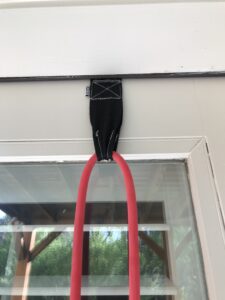 patio workout resistance tubing anchor at top of door